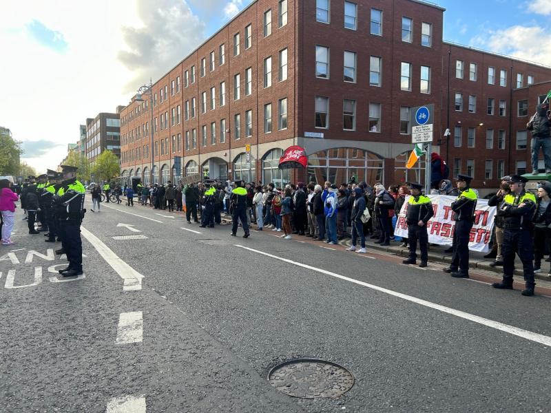 Hundreds line the streets as protesters standoff near migrant camp in Dublin