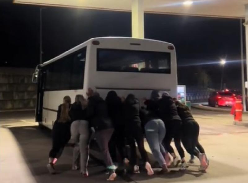 Girl power! Limerick women's rugby team put their shoulders to the wheel to move bus