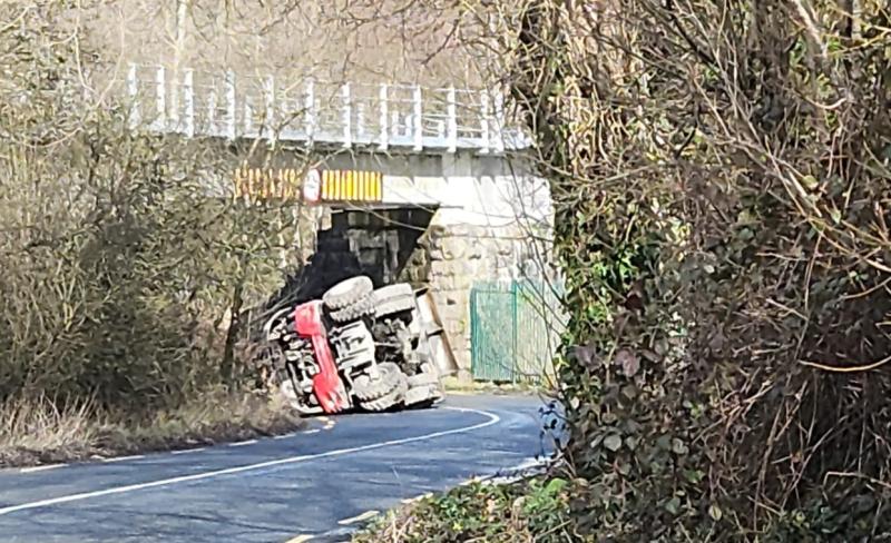 Digger overturns on approach to a bridge in Limerick