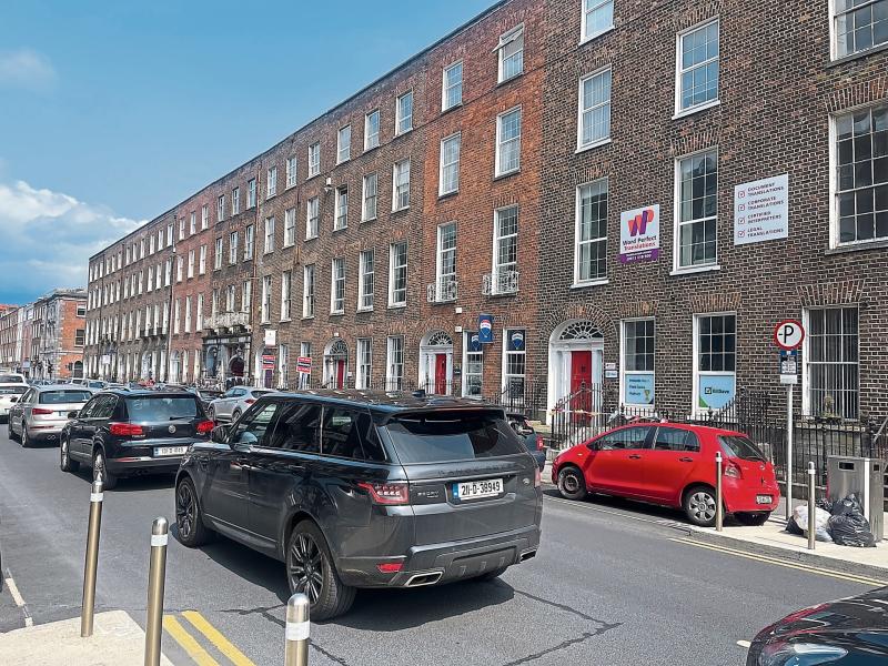 Purple, white and orange signs on Georgian Limerick building spark investigation