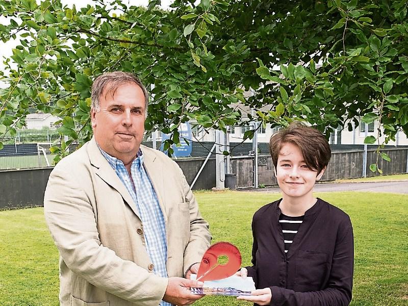 Phil Cottier presenting Ella O’Rourke with her prize