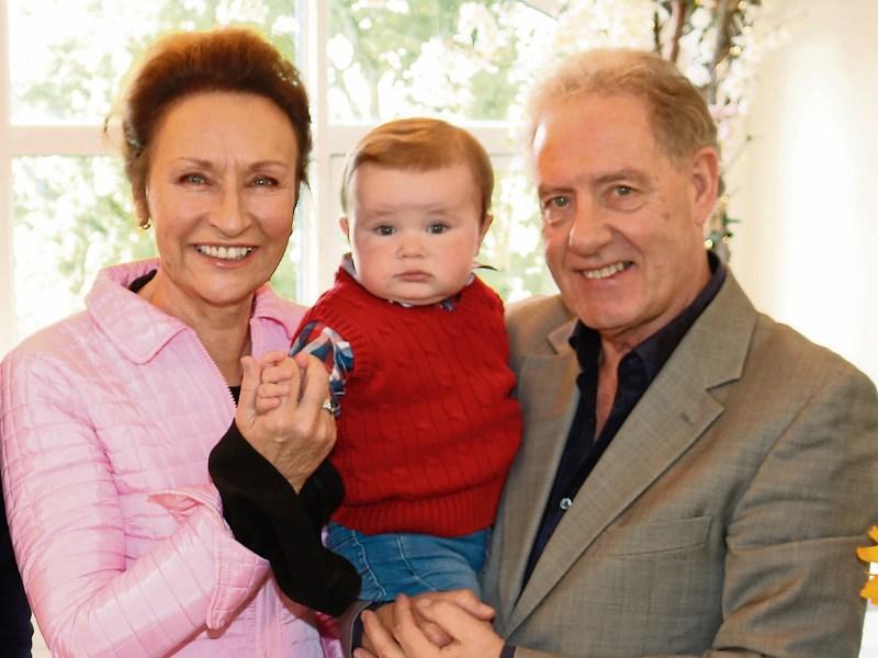 Celia Holman-Lee and husband Ger Lee with their grandchild, Alexander Lee Picture: Adrian Butler