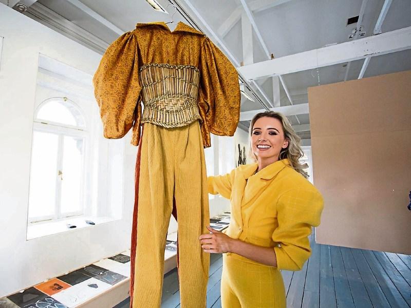 Mungret woman Aoife McNamara with a piece from her graduate collection, which is called An&aacute;il. She is also wearing one of her own designs &ndash; a three-piece suit