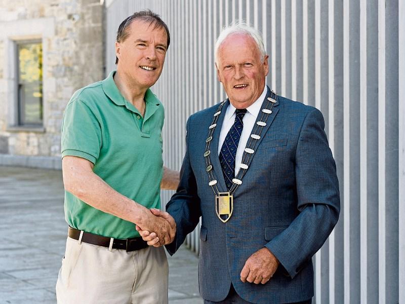 Cllr Ger Mitchell congratulates Cllr Eddie Ryan Picture: Don Moloney