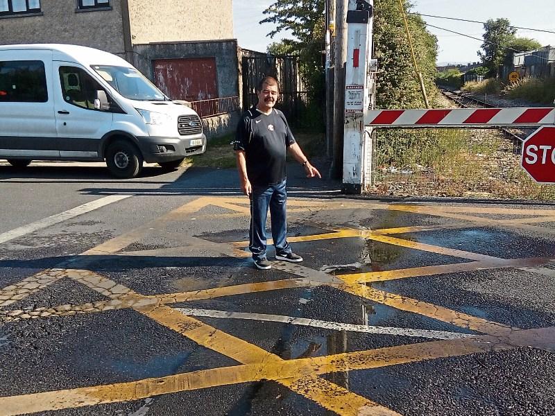 Noel Hannan points to the 12-week-old leak at Singland crossing in Limerick city