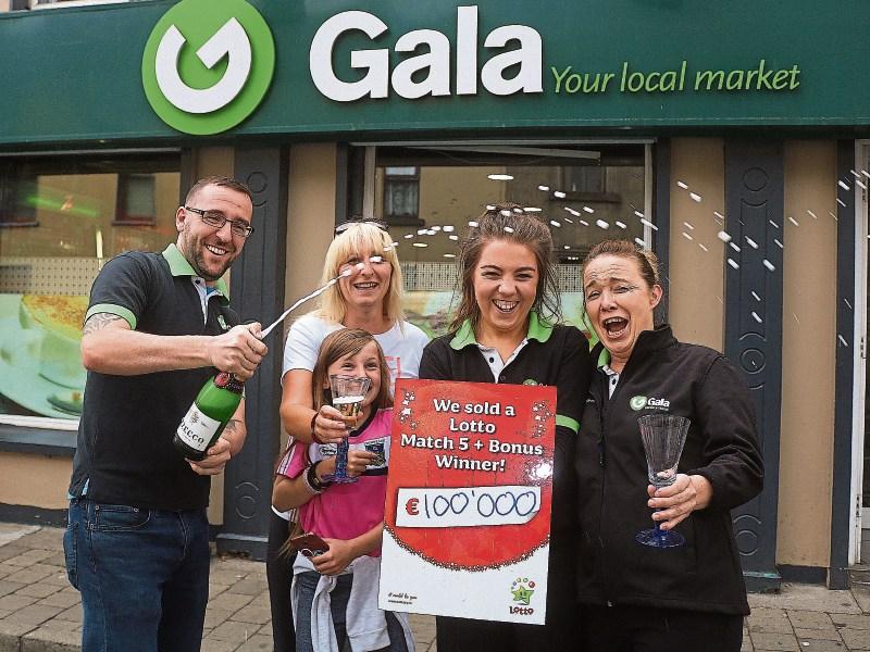 Darragh Neill, Gala supermarket Kilmallock celebrates his store selling a €100k Lotto ticket with staff members Jennifer O' Doherty and Faye Staunton, and customers Collette Madden and Rachel Connery