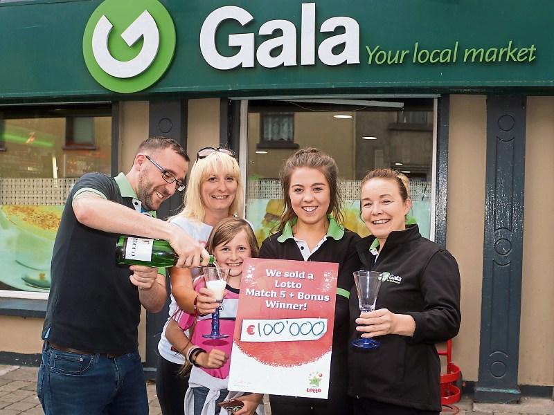 Darragh Neill, Gala supermarket Kilmallock, celebrates his store selling a €111k Lotto ticket with staff members Jennifer O' Doherty and Faye Staunton, and customers Collette Madden and Rachel Connery