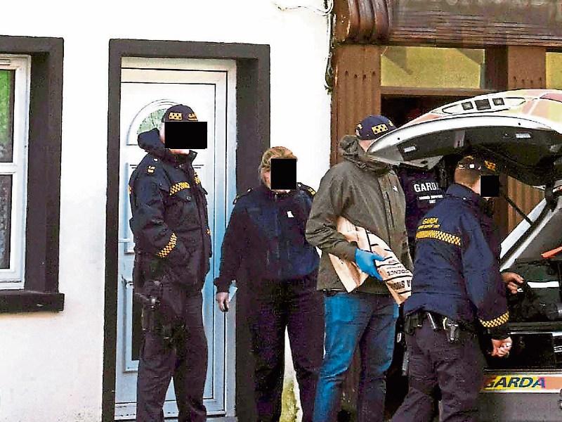 Gardai recover the shotgun from the premises in Bruff