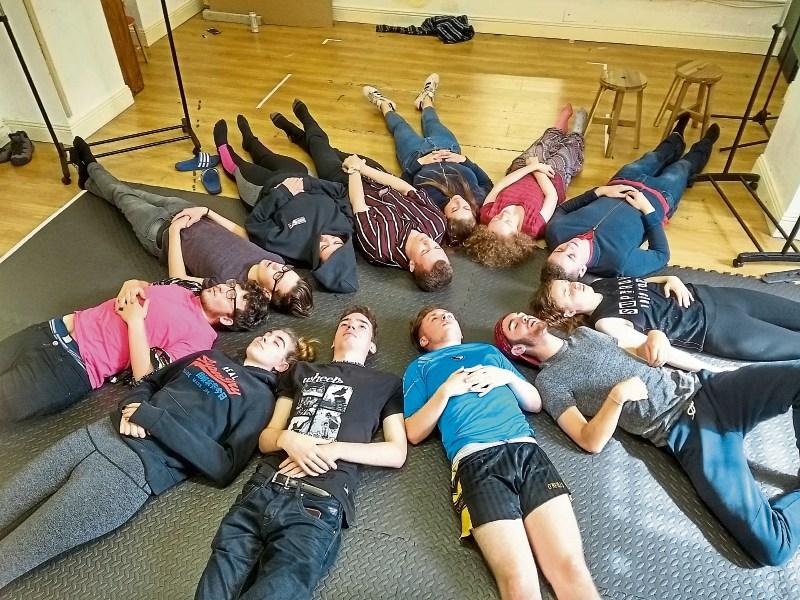 The Limerick Youth Theatre cast taking a break from rehearsals