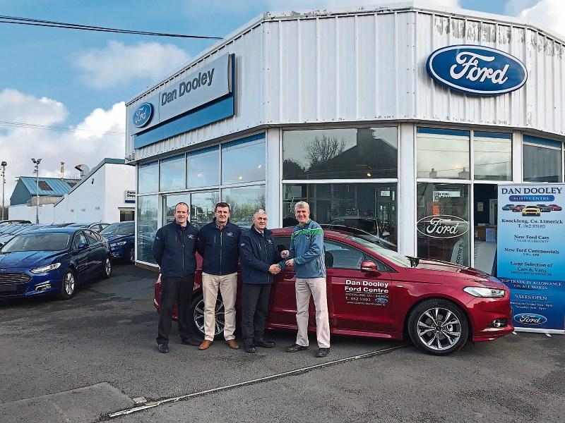 Johnny Murphy, Eddie Cosgrave, James Dooley and John Kiely receiving his brand new Ford