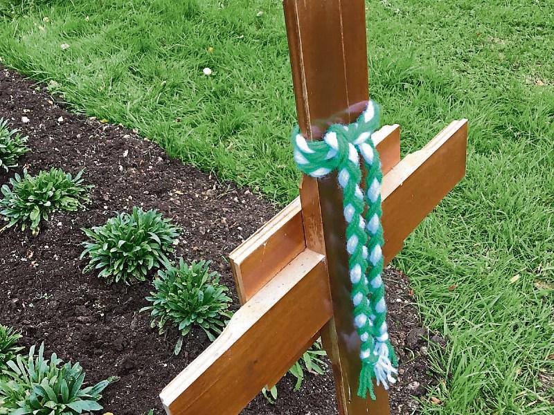The grave in Adare of    Tom English, who died six months ago, was adorned with a braid in the  green-and-white  of Limerick  the day before the match, which was his wedding anniversary