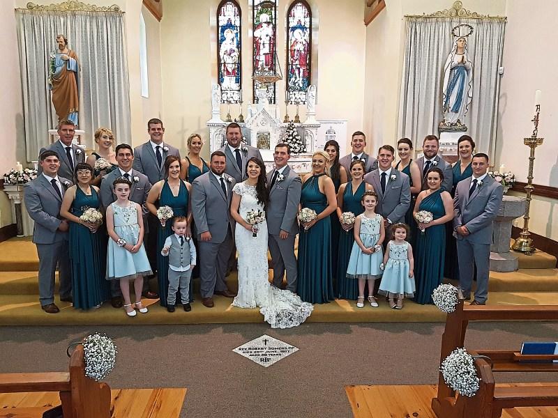 Bernadette Liston, daughter of Kathleen and the late Tom Liston, her new husband, Zachary Szyndlar and the wedding party in Cappagh church on