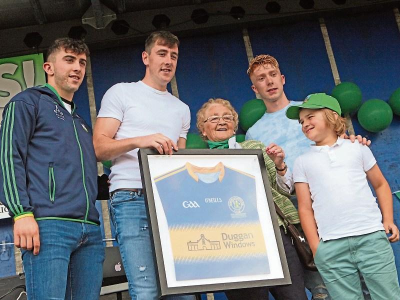 aron Gillane, Diarmaid Byrnes and Cian Lynch presented a framed jersey to Eileen O'Callaghan, Patrickswell and her grandson Matthew Colman Picture: Dave Gaynor
