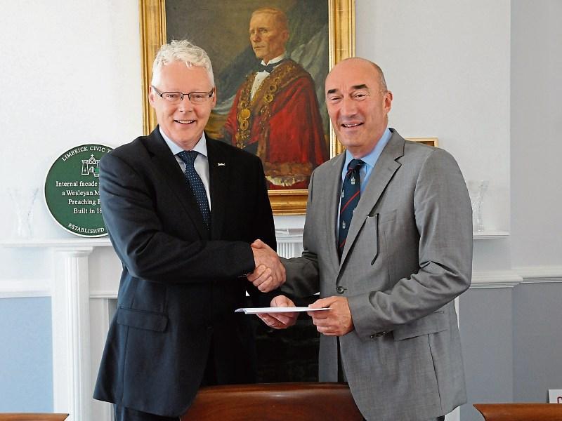 Brian Harrington, the chairperson of the Irish Hotels Federation’s, Shannon Branch presents a cheque to David O'Brien, Limerick Civic Trust Picture: Paul Mullins