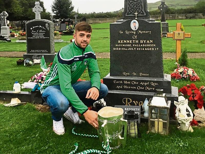 Limerick and Pallasgreen hurler, Colin Ryan “Malachy” brings the Liam MacCarthy Cup to the grave of his close friend Kenneth Ryan, killed in a quad bike accident four years ago