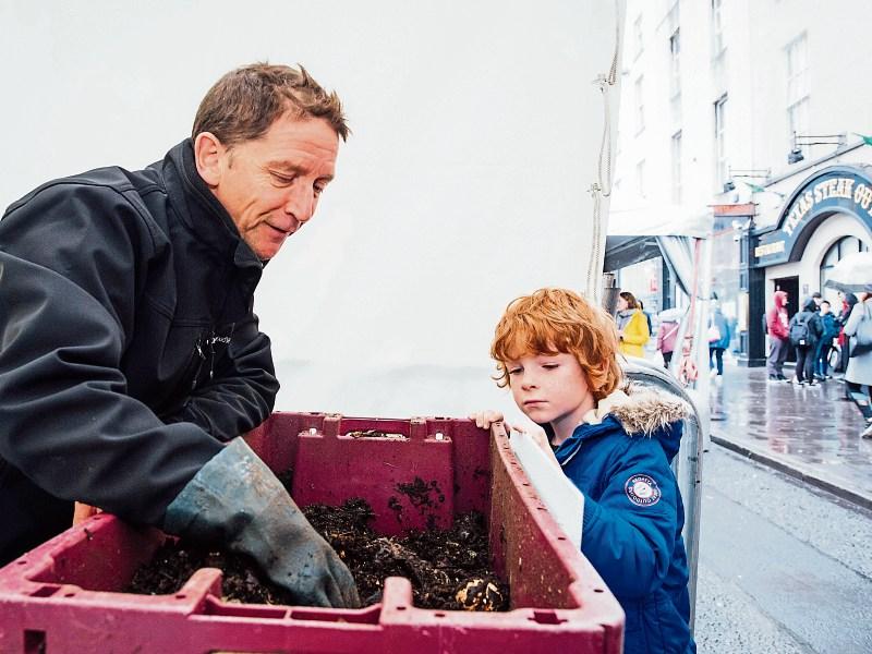 Mike Holden of Stop Food Waste with Ray Dillon, 6, in O&rsquo;Connell Street, during Car Free Day Picture: Brian Arthur