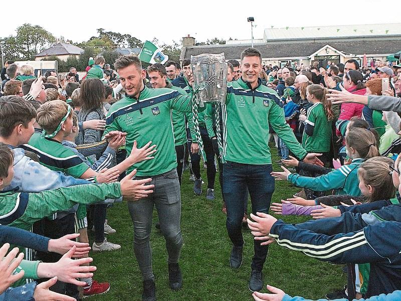 Tom and Dan Morrissey make their way through the crowd at Ahane GAA Club on Sunday Picture: Dave Gaynor