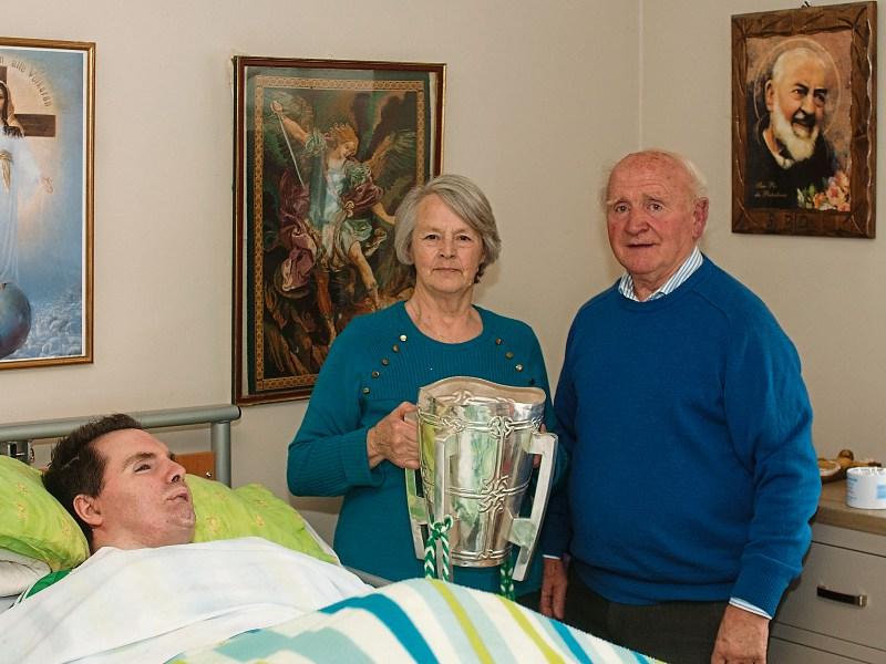 The Liam MacCarthy Cup paid a special visit to Denis Franklin and his parents, Josephine and John Picture: Mike O’Riordan