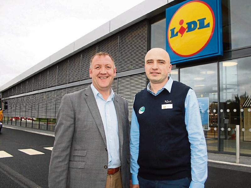 Dermot Ryan, Lidl sales operations manager, and Dzianis Baranouski, store manager outside the new store Picture: Adrian Butler