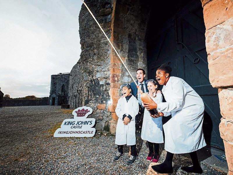 Orlaith Kelly and David Smith with Dr Lucretia Hardiman and Niall O’Callaghan and a 'Coke Gyser Experiment' at King John's Castle Picture: Brian Arthur