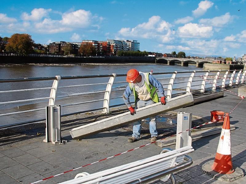 A council worker erecting flood barriers in the city ahead of the arrival of Storm Callum Picture: Adrian Butler