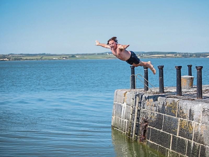 Patrick Scanlan, Newcastle West, tries an acrobatic dive off the Pier at Kilteery during the summer