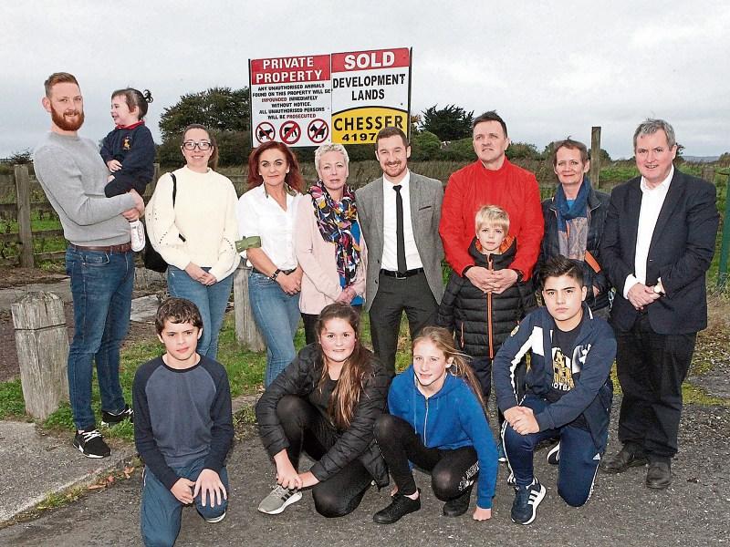 Members of Limerick ETSS board of mangement, parents’ council, principal Eoin Shinners, Kieran O'Donnell and future students beside the site for the new school Picture: Dave Gaynor