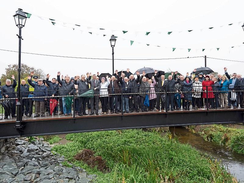 A big crowd turned up at the official opening of Kilmallock’s footbridge and gave a big wave on a windy Friday morning in the aftermath of Storm Callum