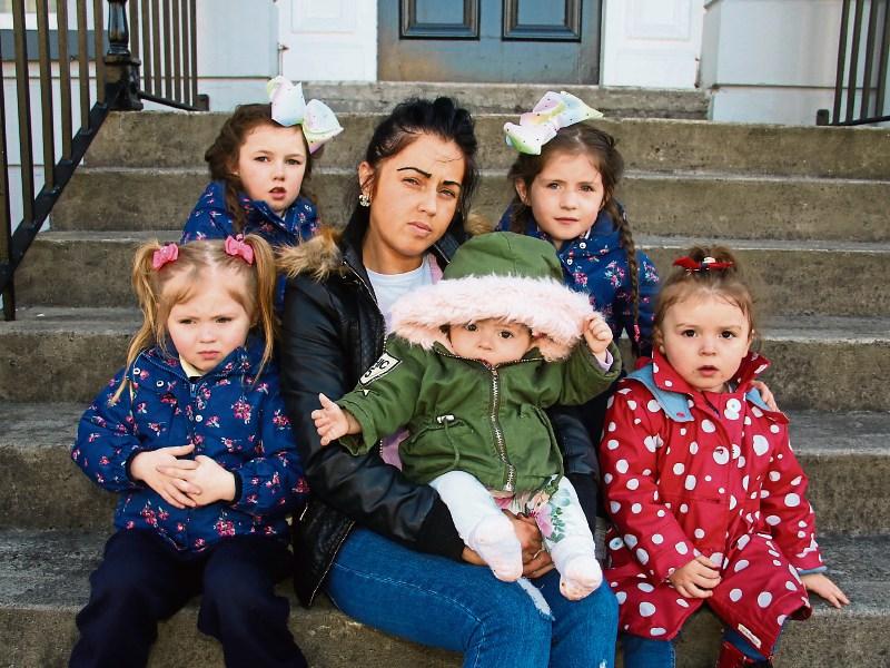 Out on the street: Aisling Bond with her children, front from left, Kelsey Bond, Cassidy Lee Bond and Kingsley Bond, back row from left, Courtney and Candice Bond Picture: Adrian Butler