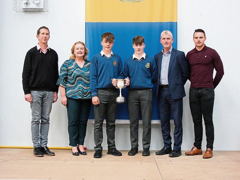 Sean O' Maolain, coach, Eilis Casey, principal, Ben White and Adam English, joint captains, John Kiely and  Michael Collins, coach