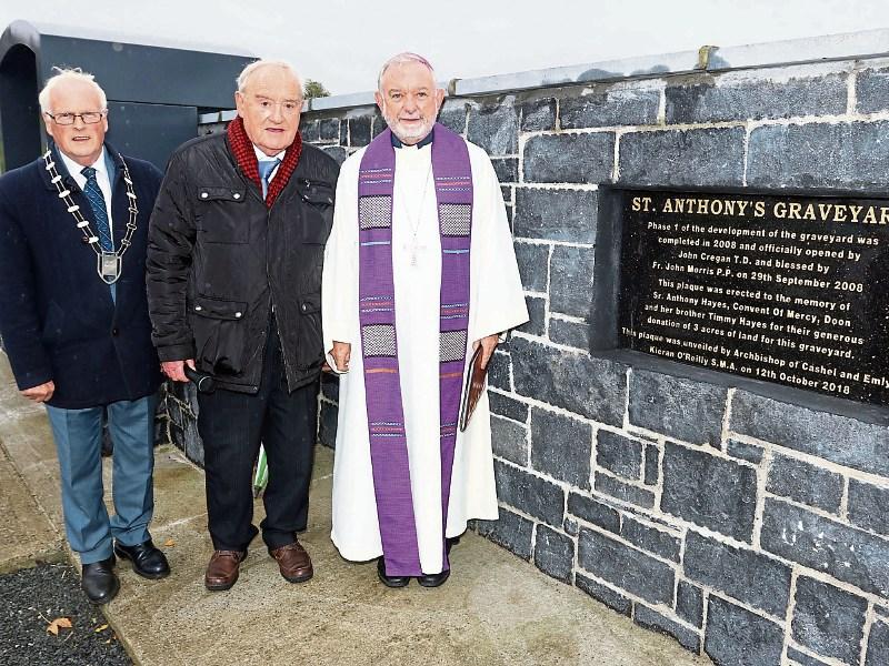 Archbishop Kieran O'Reilly unveiling and blessing the plaque with Cllr Eddie Ryan and Joe Meagher at  St Anthony's Graveyard, Oola