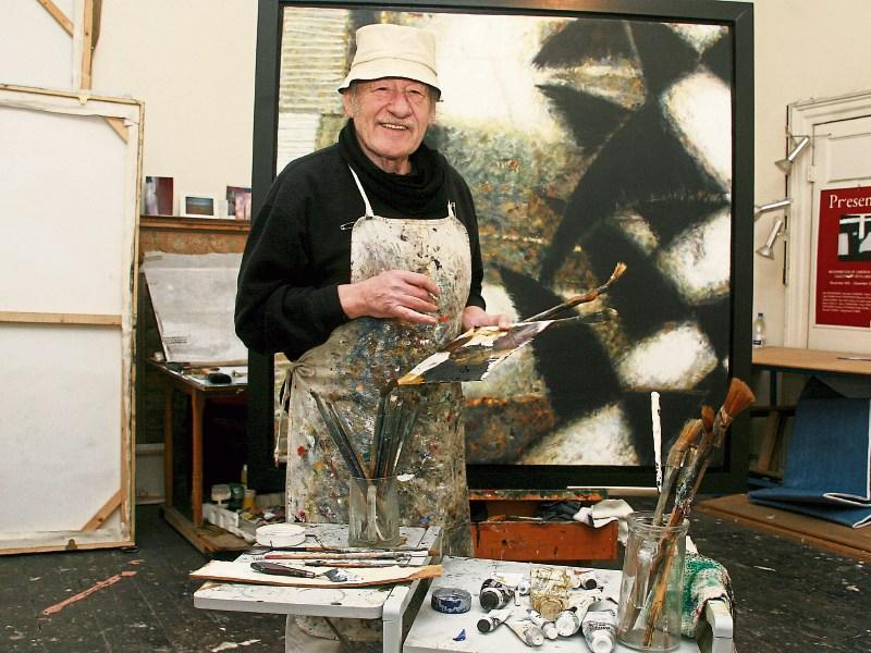 A portrait of the artist: John Shinnors in his O’Connell Street studio, finishing one of his trademark works Picture: Adrian Butler