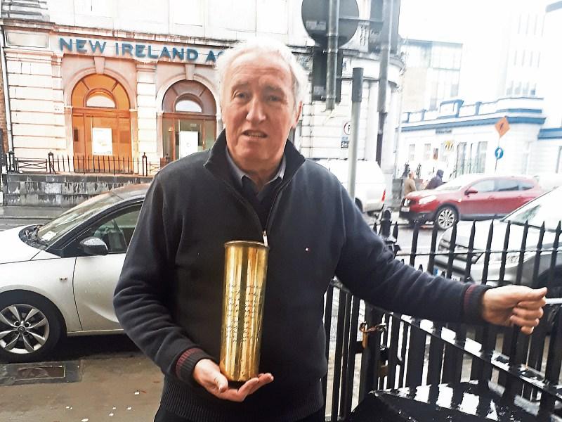 Auctioneer Patrick O'Donovan with the shell