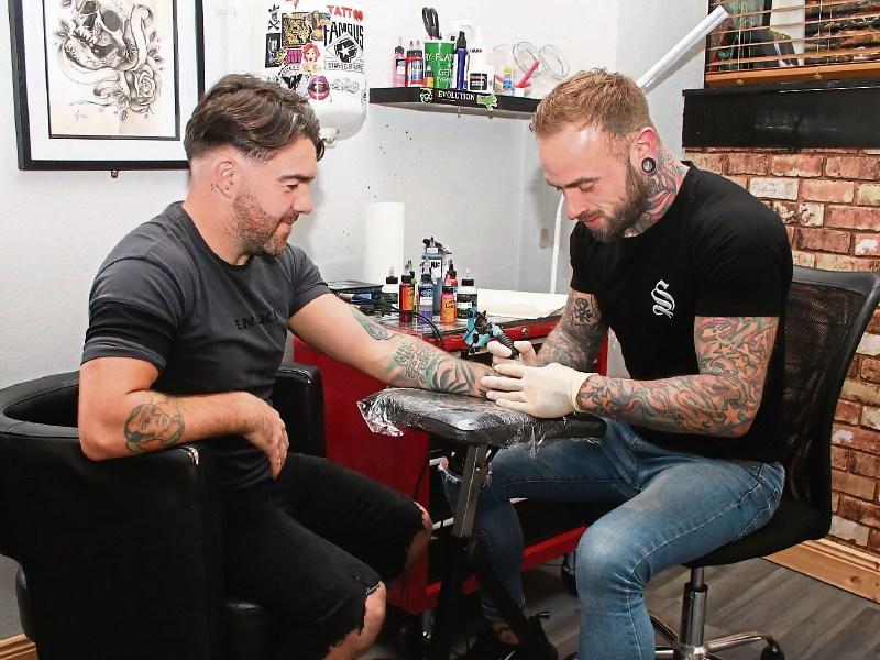 Steve Savage, right, is tattoo artist by day, wrestler by night, runs Hard Knox Tattoo parlour on Upper Gerald Griffin Street. But wrestling is where his heart really lies  Picture: Adrian Butler