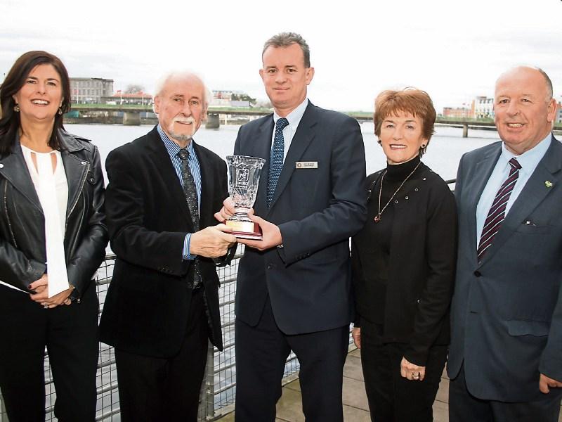 Paddy Brennan receives his award from Pat Reddan with Mary O'Riordan, Paddy's wife, Geraldine, and Eugene Phelan Picture: Adrian Butler