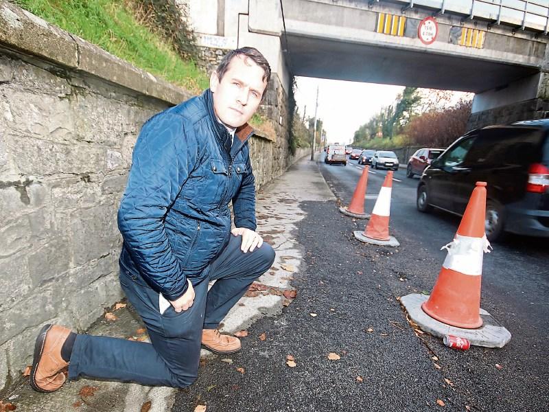 Cllr Frankie Daly inspecting the roads