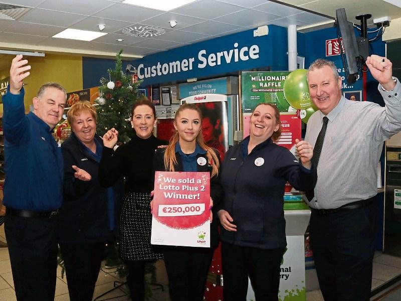 Staff at Tesco Dooradoyle celebrate selling a €250,000 Lotto Plus prize Picture: Michael Cowhey
