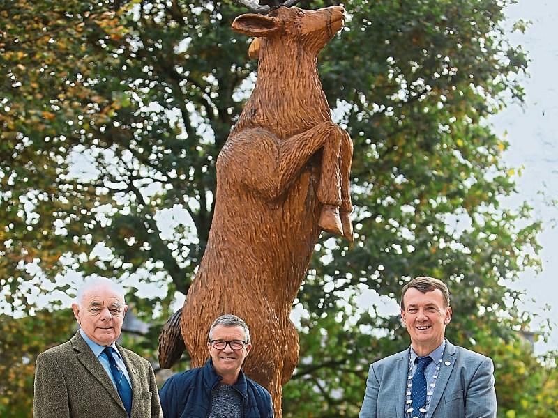 Will Fogarty, centre, with his magnificent sculpture, Noel Grimes and John Sheahan Picture: Valerie O'Sullivan