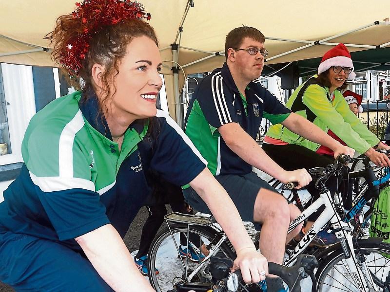 Nicole and Peter Meskall with Siobhan O'Neill at last year's Ahane Camogie Club spinathon Picture Brendan Gleeson