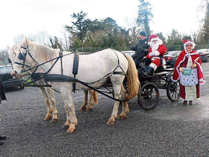 Santa and Mrs Claus, who arrived in style Picture: Mary Finucane