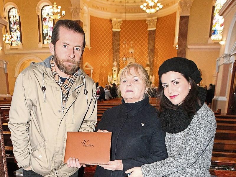 Mark O'Connor and Stefania Bardi presented a book of signatures from the Piano for Dolores event to Eileen O'Riordan after the Mass Picture: Dave Gaynor