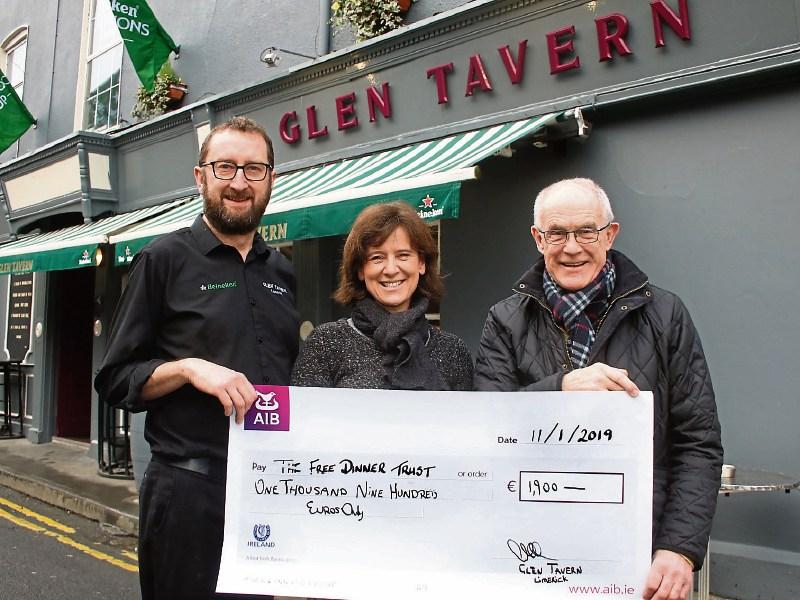 Ger Callanan of the Glen Tavern presenting a cheque for €1900, funds raised over Christmas to Siobhan Wheeler and Gordon Milne, The Free Dinner Trust Picture: Adrian Butler