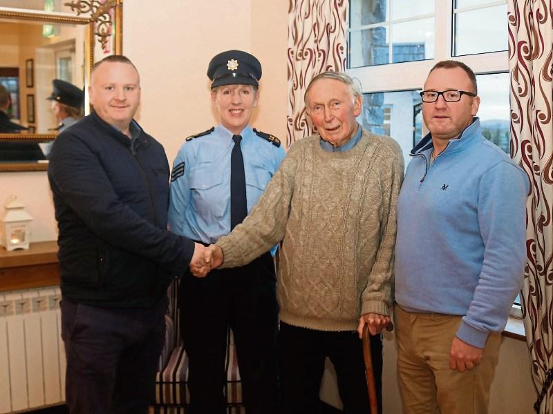 Sgt Helen Holden praises Eugene and Marcus Ryan “Alec”, Doon, who pulled Paddy McCarthy, Cappamore, out of a burning car Picture: Michael Cowhey