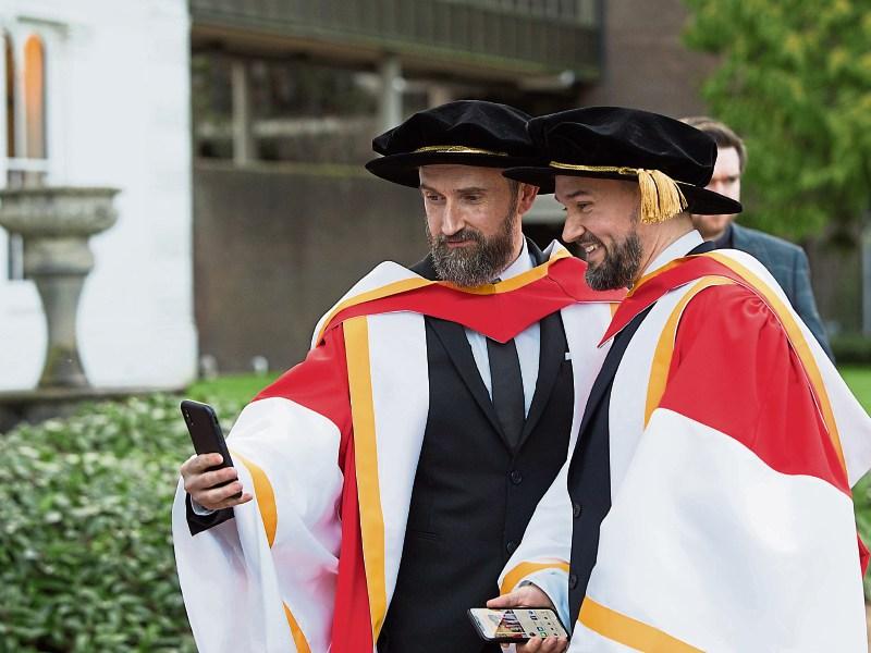 Cranberries band members Noel and Mike Hogan take a selfie at UL, where they were recently conferred with honorary doctorates Picture: Sean Curtin/True Media