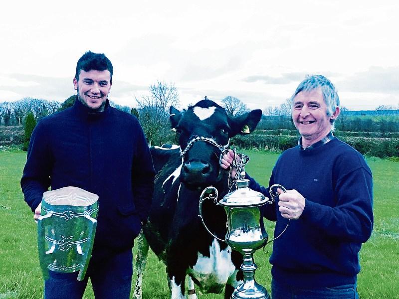 Declan Hannon and Donal Neville with Millie and two All-Ireland cups
