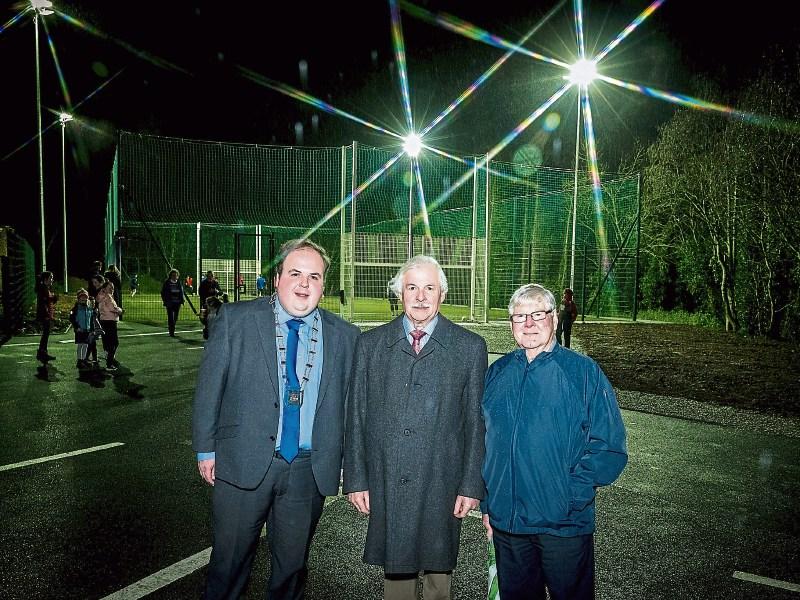 Let there be light: Cllr Adam Teskey, Leo Walsh, local election candidate, and Noel Godfrey with Ballyneety’s astroturf pitch behind them