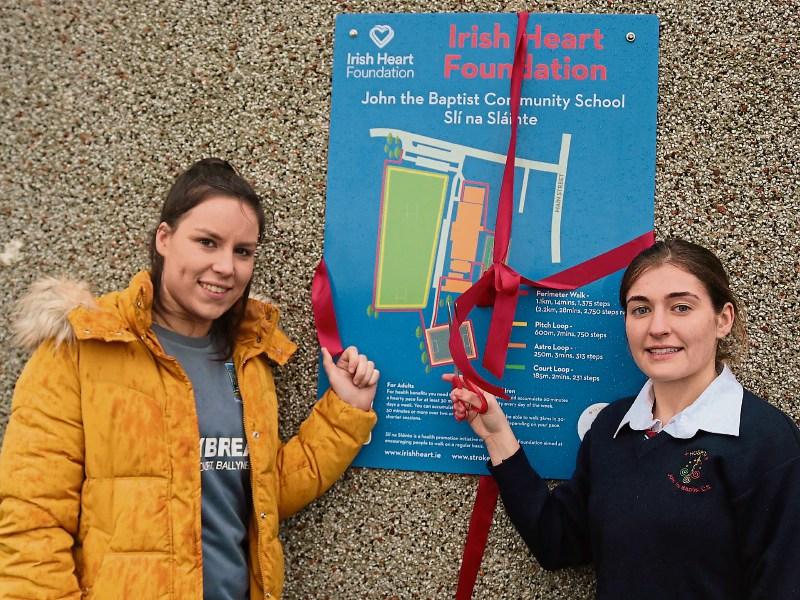 GAA stars Orlaith O Donoghue and Katie Heelan cut the ribbon on the school’s new Sli na Slainte route Picture: Michael Cowhey