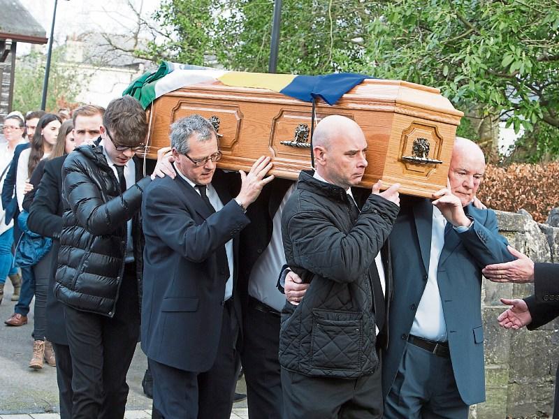 The coffin bearing the remains of Nora Bennis is carried from Our Lady of the Rosary Church following her funeral Mass Picture: Press 22