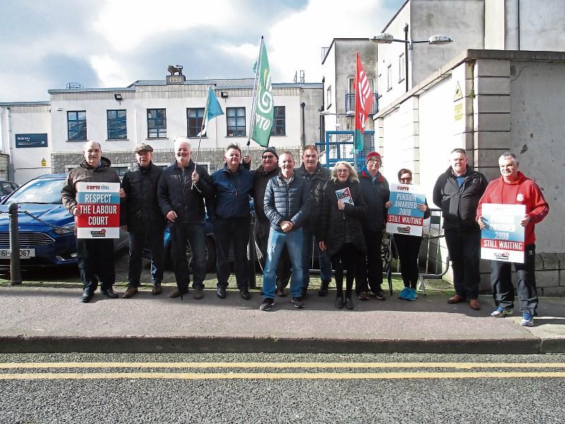 Some of the Limerick CE supervisors and assistant supervisors who took part in a protest in Cork on Monday