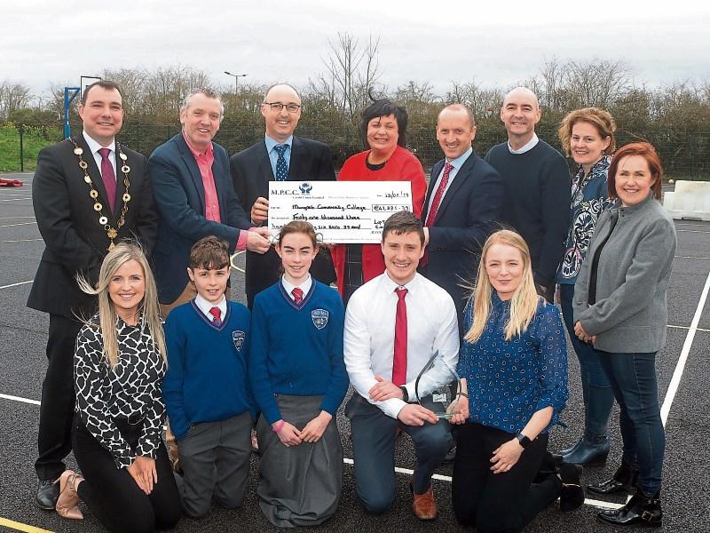 Mungret Community College board members, teachers, parents and students at the presentation of the Lip Sync cheque for over €41,000  Picture: Michael Cowhey